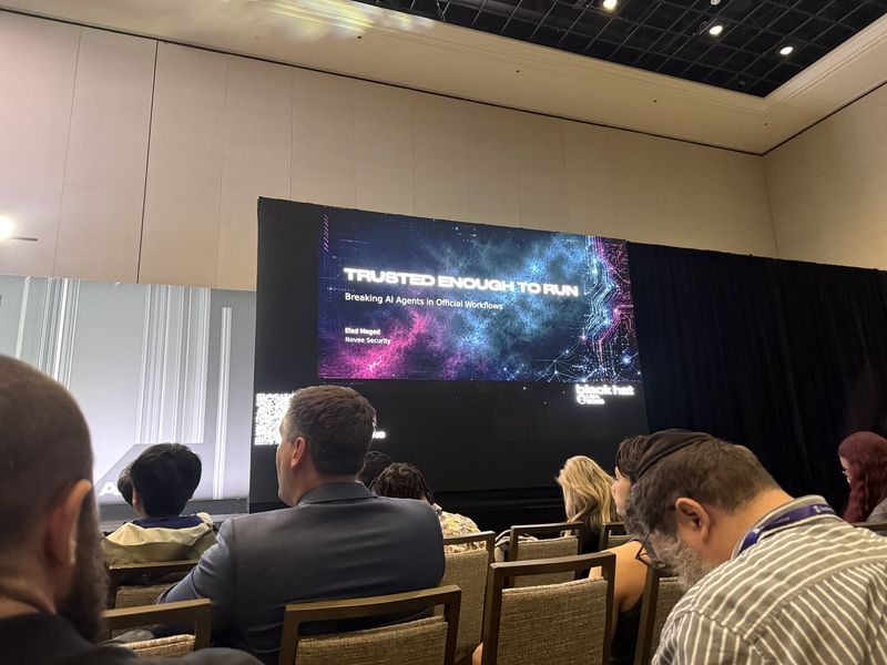 Slide: Title slide for Trusted Enough to Run, breaking AI agents in official workflows, by Elad Meged of Novee Security